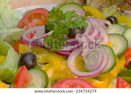 Photo shows details of various vegetable salad ingredients.