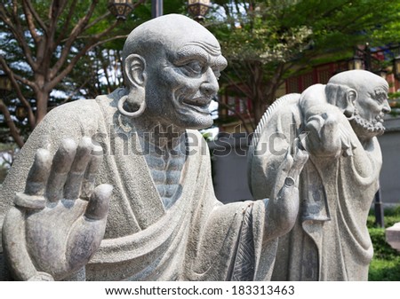 stone monk statue in the Chinese style garden
