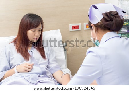 Beautiful asian patient and nurse