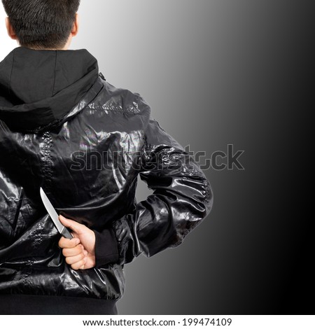Asian mysterious man hide knife in the back, isolated