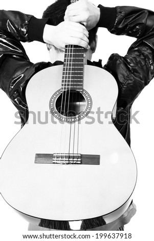 Back of Asian Musician hold his guitar, B&W processed and isolated