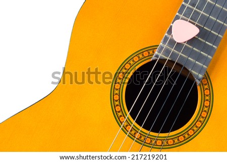 pink pick on acoustic guitar / classical guitar, isolated on white