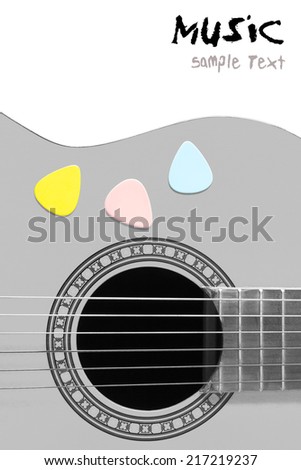 colorful picks on acoustic guitar / classical guitar, B&W guitar body processed & isolated on white