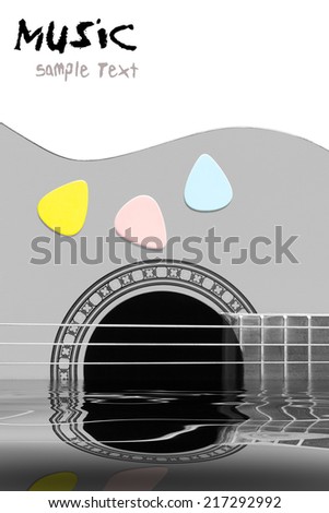 colorful picks on acoustic guitar in the water and reflection, isolated on white / concept : music was originated from nature