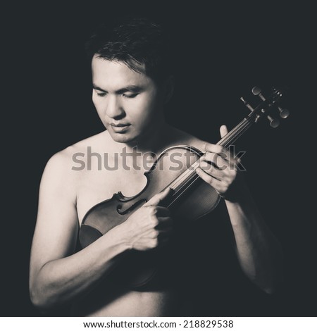 Portrait of Attractive Topless Handsome Asian male Musician plays Violin, B&W old film processed & isolated on black