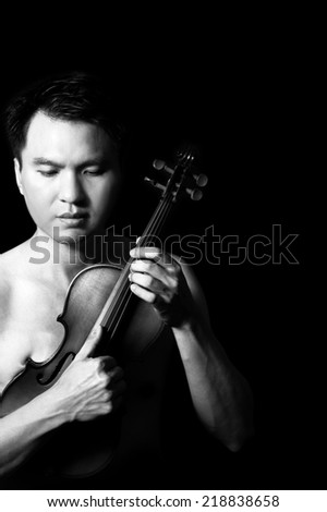 Portrait of Attractive Topless Handsome Asian male Musician plays Violin, B&W  processed & isolated on black
