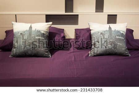 purple bed in bedroom