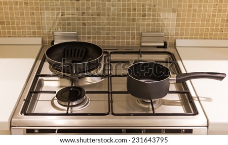 modern stove & black pan in kitchen minimalism interior design