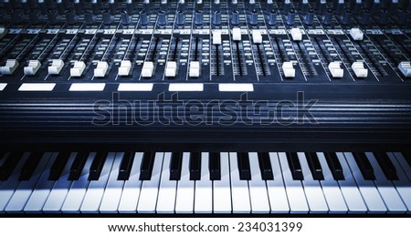 studio mixer & keyboard, electric piano, synthesizer in home studio