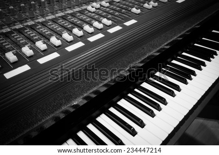studio mixer & keyboard, piano, synthesizer in home studio, on stage