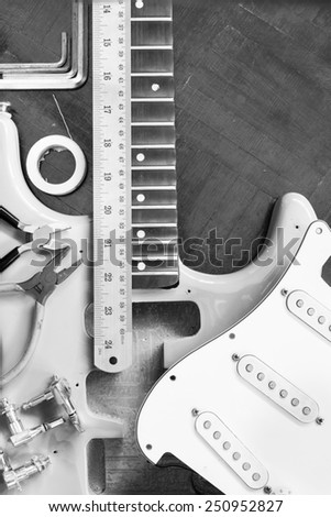 yellow electric guitar on wood in repair & guitar maker luthier workshop , fixing guitar & music instrument repairing concept