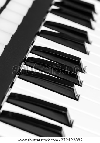 studio music keyboard piano synthesizer closeup & shallow dept of field , black and white processed