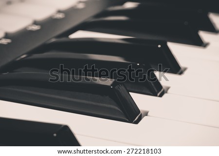 studio music keyboard piano synthesizer closeup & shallow dept of field , B&W vintage filter