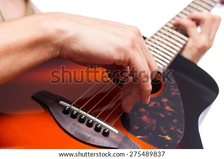 musician play sunburst color acoustic guitar , focus to right hand fingertip / isolated on white