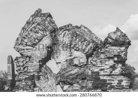 Ancient wreckage palace arch ( look like human face to face ) as a result of war in Ayuthaya old city thailand, Cultural Attractions, Historic site / black and white old film processed