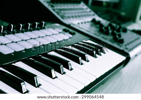 keyboard, piano, synthesizer & digital mixer in home studio for music background