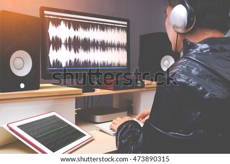 sound engineer, audio editor working in TV or radio broadcasting studio