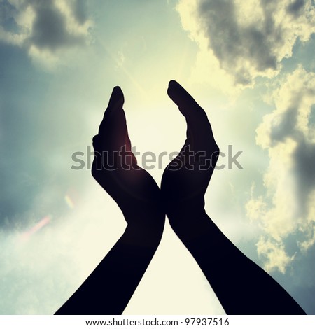 hope in a sky with hand silhouette