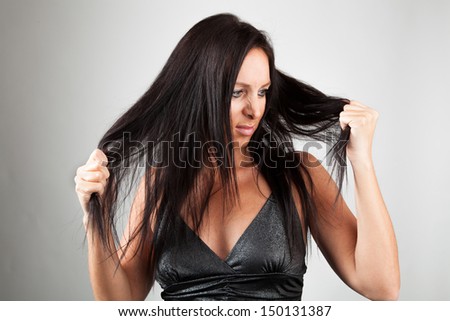 Woman pulls at his hair