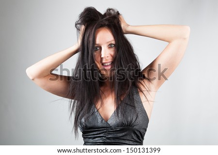 Woman tearing her hair and looks shocked