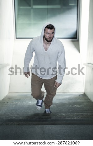 Attractive man walks up the stairs