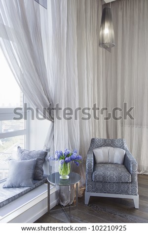 comfortable room corner, leather chair and tea table by the wind