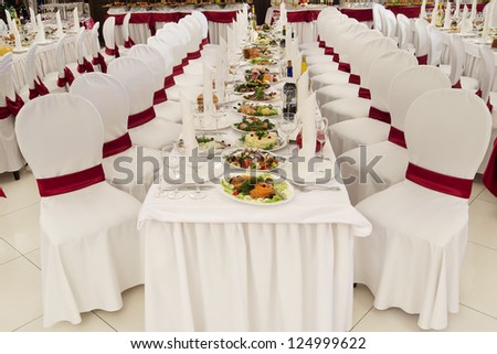 a restaurant banquet room decorated for a wedding party