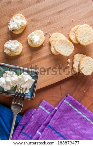Abstract photo of goats cheese on mini toasts