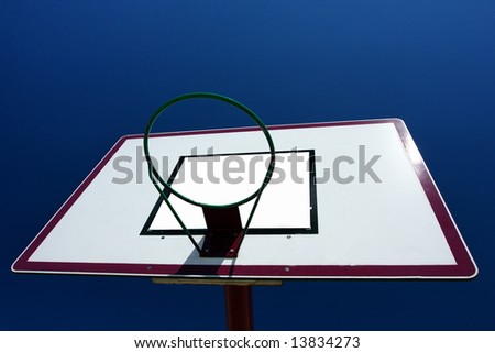 Basketball basket on blue sky background.