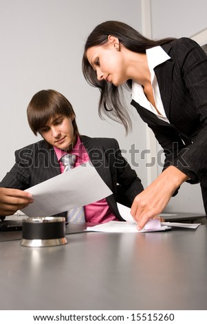 Two contemporary business people at a meeting