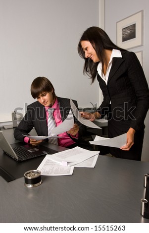 Two contemporary business people at a meeting