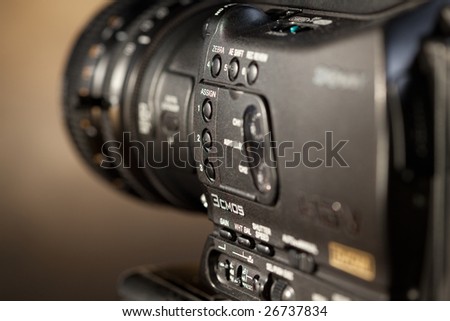 Close-up of professional digital video camera.
