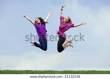 pretty girls with brown hair and green. stock photo : pretty two girls