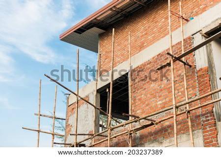 blue sky and townhome & Construction Site in progress to new house in Thailand