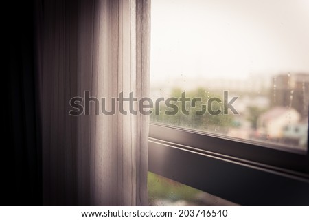 white curtain beside the window sliding. concept of loneliness
