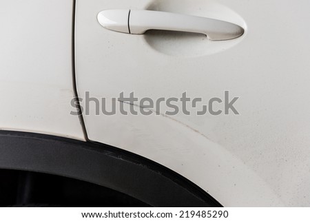 Scratched car paint with door handle