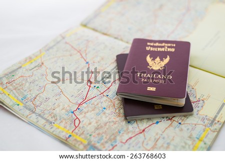 Passport on map. travel concept. Focus at THAILAND Passport Book