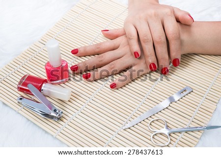 Manicure - Beautiful manicured woman\'s nails with red nail polish