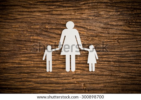 paper chain family symbolizing on wooden background. love family concept