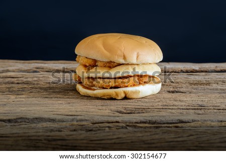 still life of chicken hamburger on top wooden table
