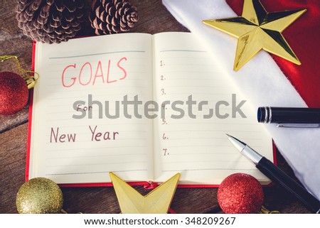 New Year\'s goals with colorful decorations. New Year\'s goals are resolutions or promises that people make for the New Year to make their upcoming year better in some way