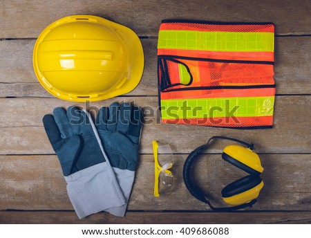 Standard construction safety equipment  on wooden table. top view