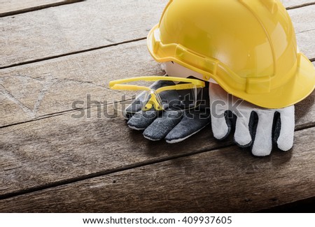 Standard construction safety equipment on wooden table and Light from the window