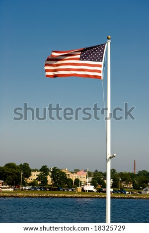 The American flag against the town 2