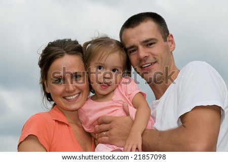 Happy parents with the daughter close up
