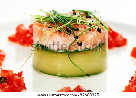 Salmon fish dish decorated on a white plate