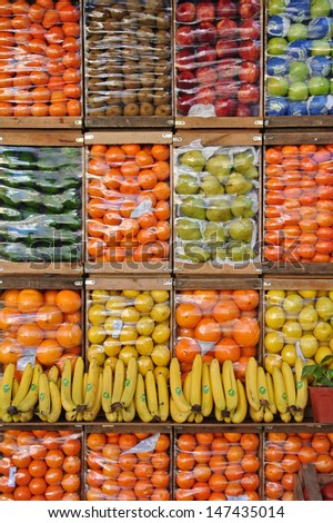 Different colorful fruits organized in crates