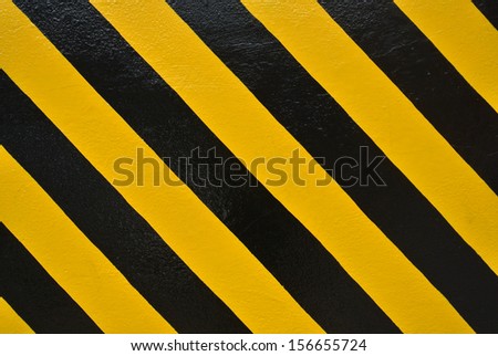 Yellow and black stripes painted on the wall