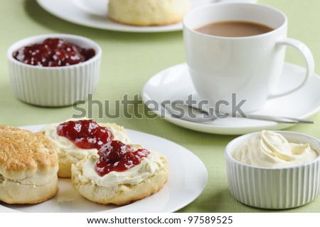 stock-photo-traditional-english-cream-tea-of-scones-clotted-cream-strawberry-jam-and-a-cup-of-tea-these-are-97589525.jpg