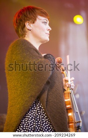 Traena, Norway - July 10 2014: during the concert of the Norwegian folk rock band Hekla Stalstrenga at the Traenafestival, music festival taking place on the small island of Traena.